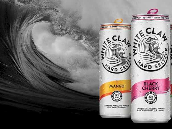 Three White Claw Hard Seltzers stand beside a giant crashing wave, colorful labels: Mango, Black Cherry, and Watermelon, ready to ride the tide.